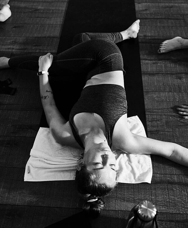 A woman stretching in a yoga class